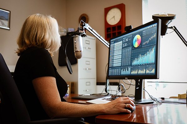 Kelly Berry - Nerdy Researcher at her computer